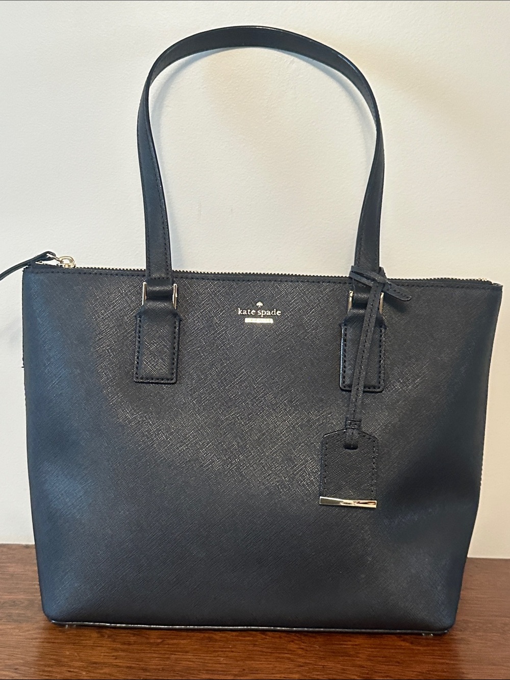 kate spade black leather tote with gold logo